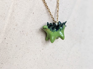 green stegosaurus pendant