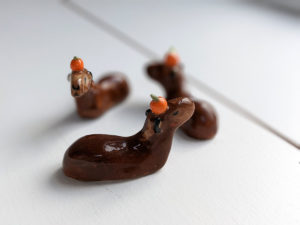 porcelain capybara figurine and orange