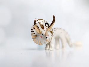porcelain triceratops figurine with gold