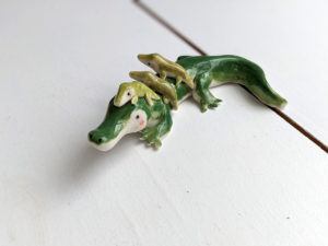 porcelain crocodile mama figurine