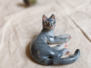 porcelain cat figurine grey tabby tongue out