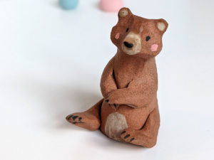red clay bear figurine
